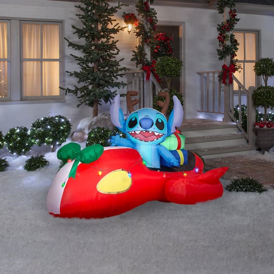 4ft. Airblown® Disney® Inflatable Stitch in Red Speeder Car with Light String Christmas Décor